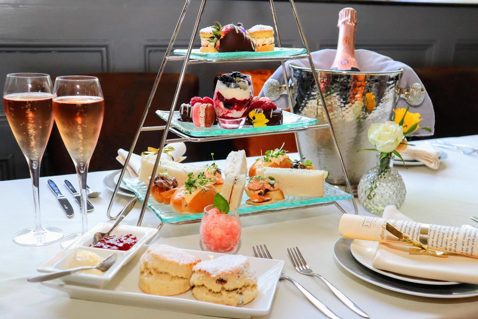 Afternoon tea with Champagne, warm scones, savouries and cakes